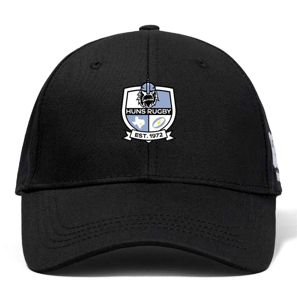 The Austin Huns Rugby Flexfit Drill Cap by EMB Canterbury is a black curved brim cap featuring the Huns Rugby embroidered logo patch and "EST. 1972" on the front.