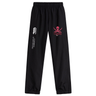 Black sweatpants with cuffed hem, featuring a pink skull and crossbones logo and a vertical text logo on the left leg. - SUNY Maritime Cuffed Hem Stadium Pant by EMB Canterbury