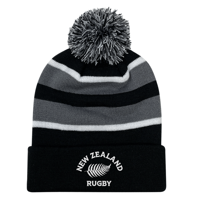 The EMB Augusta Nations of Rugby New Zealand Hooped Pom-Pom Beanie features black and gray stripes and a fern emblem—an ideal addition to any All Blacks fan's hat collection.