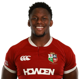 Maro Itoje faces forward, smiling in a red Icons British & Irish Lions 2025 shirt with sponsor logos and an "Australia 2025" emblem—ideal for fans and collectors of the Maro Itoje Front Signed British & Irish Lions 2025 Shirt.