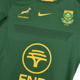 Nike's Springboks 26/27 Authentic Match Home Jersey features a green design with the Springboks logo, Nike logo, South African Rugby crest, and yellow sponsor detail.