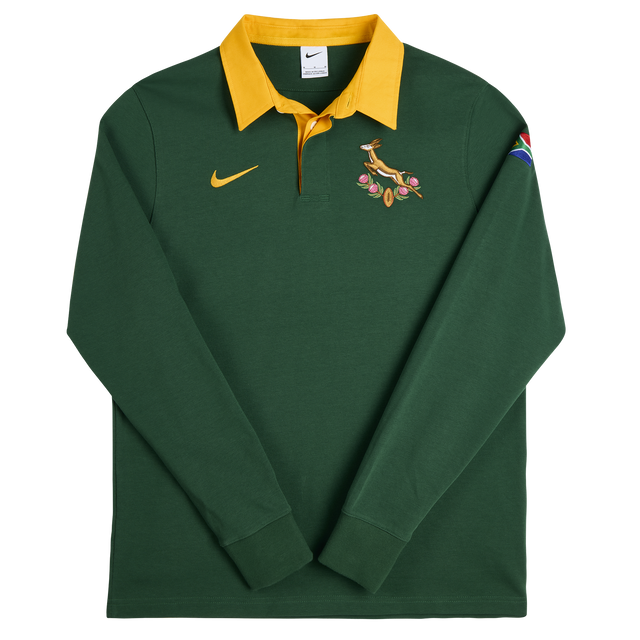 Show your pride with the Springboks Home Long Sleeve Rugby Shirt by Nike, featuring a green body, yellow collar, Nike logo, Springbok emblem, and the South African flag on the sleeve—ideal for every rugby fan.