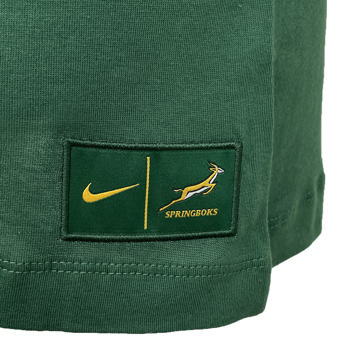 Close-up of the Women's Springboks 25 Bokke T-Shirt by Nike in green, featuring the iconic logo and Springboks emblem, with yellow text and hem stitching. A must-have for any BOKKE fan or as a stylish Nike women’s tee.