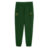 The Nike Springboks Training Pant features a green tapered fit, the official Springboks logo, and a yellow Nike swoosh, inspired by the authentic training gear worn during rugby preparation.