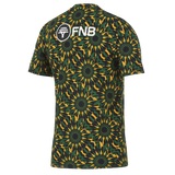 The Nike Springboks 26/27 Pre-Match Top is a short-sleeve rugby shirt with a multicolored geometric design and the FNB logo in white on the upper back—ideal for South Africa rugby fans.