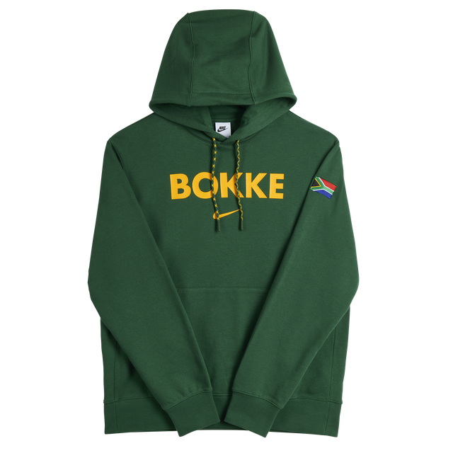 The Nike Springboks Bokke Pullover Hoodie features a green design, bold yellow "BOKKE" on the chest, a South African flag patch on the left sleeve, and classic Springboks style.