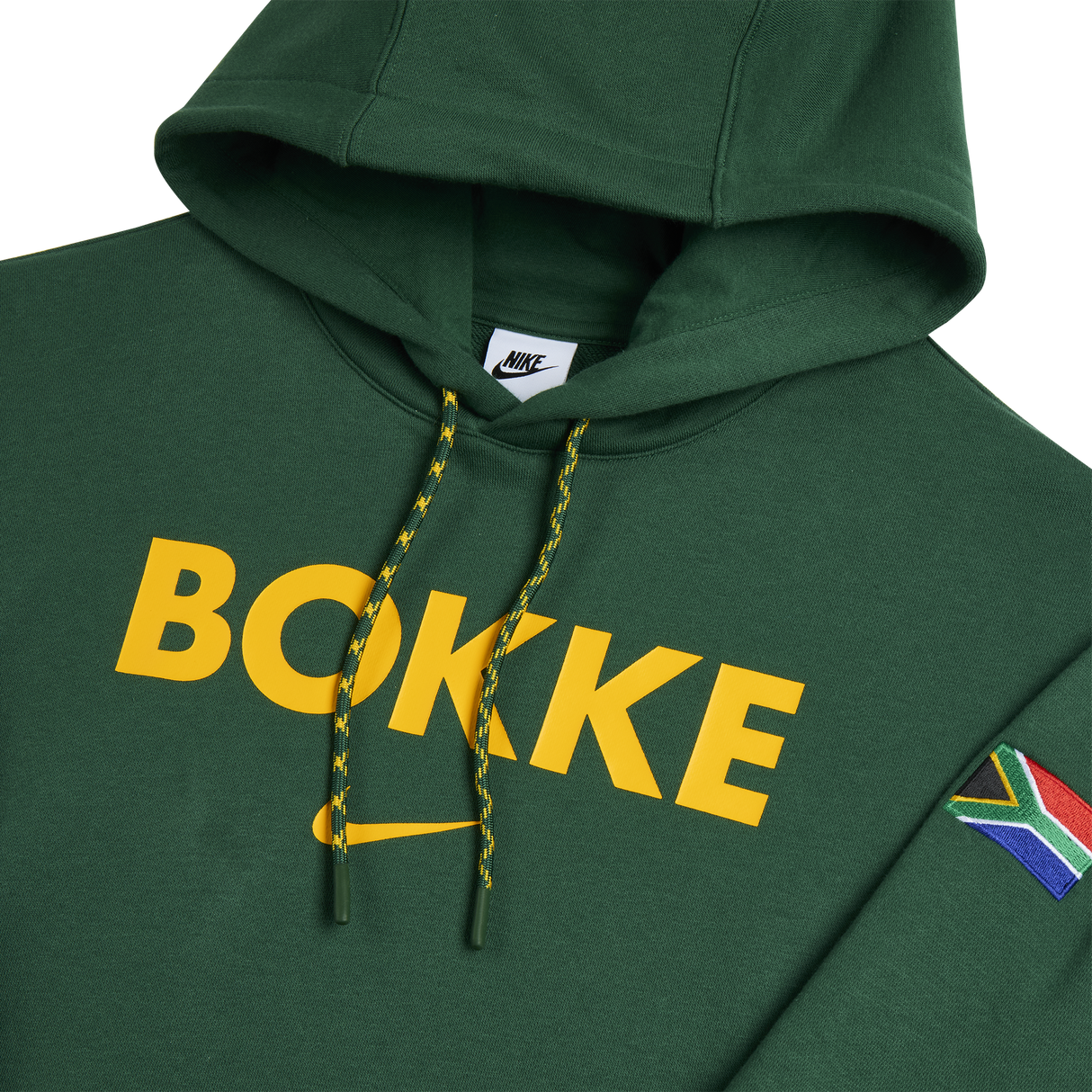 The Nike Springboks Bokke Pullover Hoodie features "BOKKE" in yellow on the front, a South African flag patch on the sleeve, and is a must-have for any fan.