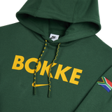 The Nike Springboks Bokke Pullover Hoodie features "BOKKE" in yellow on the front, a South African flag patch on the sleeve, and is a must-have for any fan.