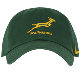 Show your support with the Springboks Heritage 86 Cap by Nike, a green cap featuring a yellow leaping springbok, "SPRINGBOKS" on the front, and the iconic yellow Nike logo on the side.