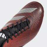 Close-up of the adidas Adizero RS15 Ultimate SG 24 in Core Black, Silver Metallic, and Solar Red. This black athletic shoe features red linear patterns and silver diagonal stripes with black laces. These lightweight boots are crafted from recycled materials, offering eco-friendly performance on the field.
