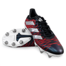 The adidas Kakari Z.1 SG 24 in Core Black, Silver Metallic, and Better Scarlet features a red and black patterned upper with white stripes on the sides. The cleats have white soles with durable metal studs. Crafted by adidas using recycled materials, one cleat is upright while the other lies on its side to highlight the robust sole design.
