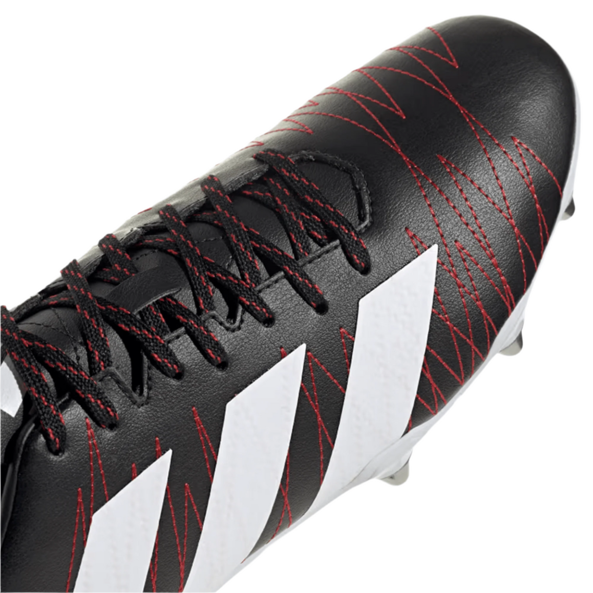 Close-up of the adidas Kakari SG in Core Black, featuring red stitching, white zigzag patterns on the side, and black laces. Crafted from recycled materials, this design pays homage to the iconic adidas rugby boots.