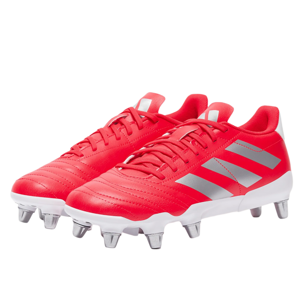 The Lucid Red adidas Kakari SG cleats, featuring silver metallic stripes and a rugged eight-stud soleplate for field dominance, are presented on a pristine white background.
