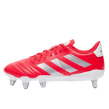 Displayed on a pristine white background, the Lucid Red adidas Kakari SG cleat boasts sleek silver metallic stripes and an eight-stud soleplate, echoing a high-performance rugby boot.