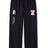 The Philly Whitemarsh Open Hem Stadium Pant by EMB Canterbury features an elastic waistband, white "Canterbury of New Zealand" logo on the left leg, red and white emblem on the right leg, and a classic men’s open hem design.