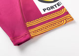 Close-up of maroon fabric with yellow patterns featuring a partial logo "PORTE," reminiscent of the Gallagher Chiefs Super Rugby Replica Training Jersey 25/26 by Classic Sportswear.