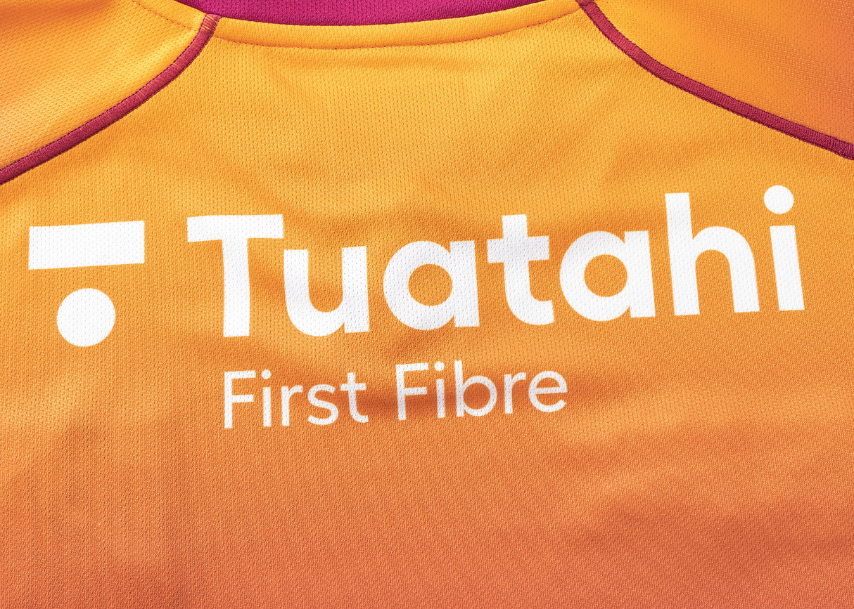 An orange Gallagher Chiefs Replica Training Jersey 25/26 by Classic Sportswear features "Tuatahi First Fibre" in white text.