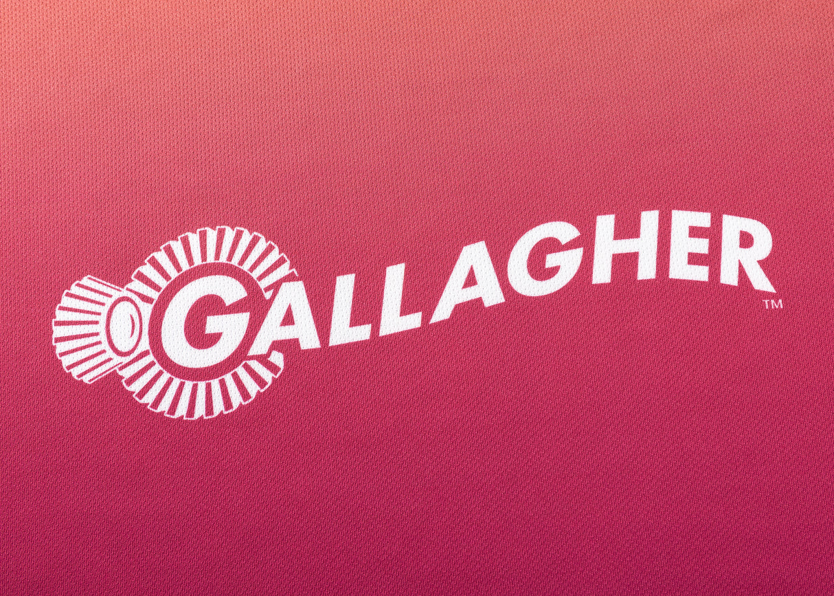 The Gallagher Chiefs Super Rugby Replica Training Jersey 25/26 by Classic Sportswear features stylized "Gallagher" text and a logo with a spool design on a red gradient background, reminiscent of Classic Sportswear branding.