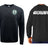 The WRS Augusta Woodlands Youth Paw Print Pocket Logo Crewneck is a black fleece sweatshirt with a circular paw print logo on the front left chest and “WOODLANDS RUGBY” printed in white across the back.