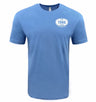The UNC 1966 Club Tee by EMB LAT is a light blue short-sleeve shirt with a small white oval logo on the left chest reading "THE 1966 CLUB UK PROFESSIONAL"—ideal for Tar Heel rugby fans and lovers of classic club tee style.