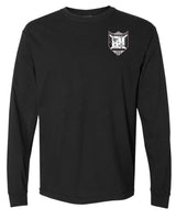 The Troy Rugby Long Sleeve Comfort Tee by EMB S&S Activewear is a black long sleeve shirt with a small embroidered shield-shaped logo featuring letters and symbols on the left chest.