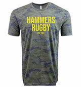 The Montgomery Yellowhammers "Hammers Rugby" Supersoft Tee by WRS LAT features a gray and blue camo design with "HAMMERS RUGBY EST 1984" in yellow. This unisex tee is made from supersoft cotton for all-day comfort.