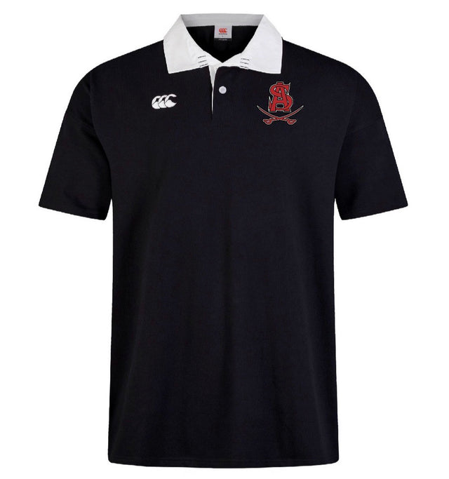 The Archbishop Spalding Solid Classic SS Rugby Jersey by EMB Canterbury is a black short-sleeved polo featuring a white collar, Canterbury branding on the right chest, and a red embroidered "SA" with crossed swords on the left.