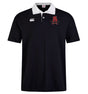 The Archbishop Spalding Solid Classic SS Rugby Jersey by EMB Canterbury is a black short-sleeved polo featuring a white collar, Canterbury branding on the right chest, and a red embroidered "SA" with crossed swords on the left.