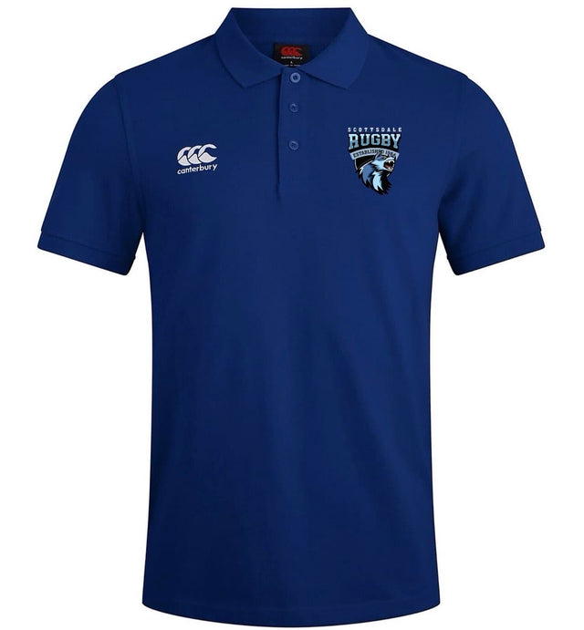 The Scottsdale Rugby Royal Waimak Rugby Polo by EMB Canterbury is a blue men's short-sleeve shirt featuring the Canterbury logo on the right chest and a Scottish Rugby lion head on the left.