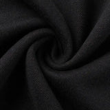 Close-up of black fabric with a spiral twist pattern, reminiscent of the Limited Edition Gallagher Chiefs Super Rugby 25/26 Retro Jersey by Classic Sportswear.