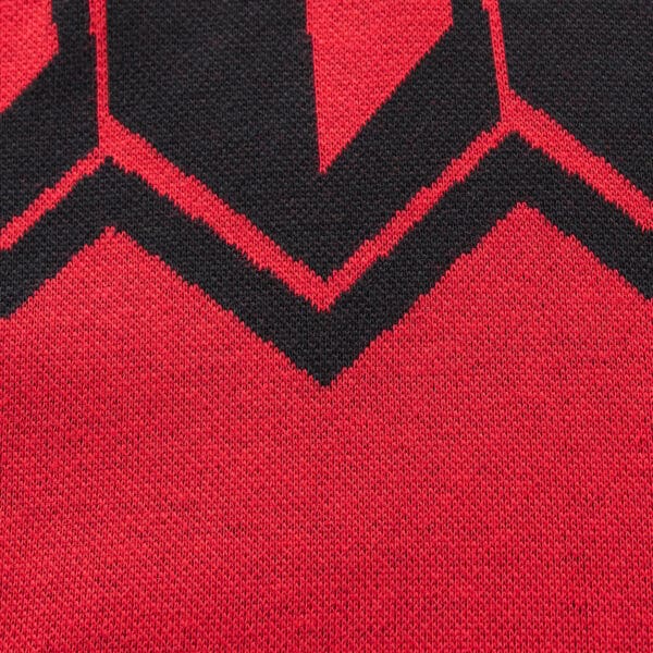 Close-up of the Limited Edition Crusaders Super Rugby 25/26 Retro Jersey by Classic Sportswear, featuring a red and black knitted fabric with a zigzag pattern, echoing a classic sportswear design.