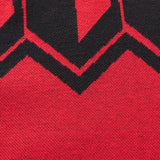 Close-up of the Limited Edition Crusaders Super Rugby 25/26 Retro Jersey by Classic Sportswear, featuring a red and black knitted fabric with a zigzag pattern, echoing a classic sportswear design.