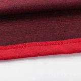 Close-up of a fabric with a red and black mesh pattern, similar to the Limited Edition Crusaders Super Rugby 25/26 Retro Jersey by Classic Sportswear, showcasing a vibrant red hem along the edge.