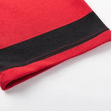 Close-up of a red fabric edge featuring a black stripe and visible stitching, reminiscent of the Limited Edition Crusaders Super Rugby 25/26 Retro Jersey by Classic Sportswear.