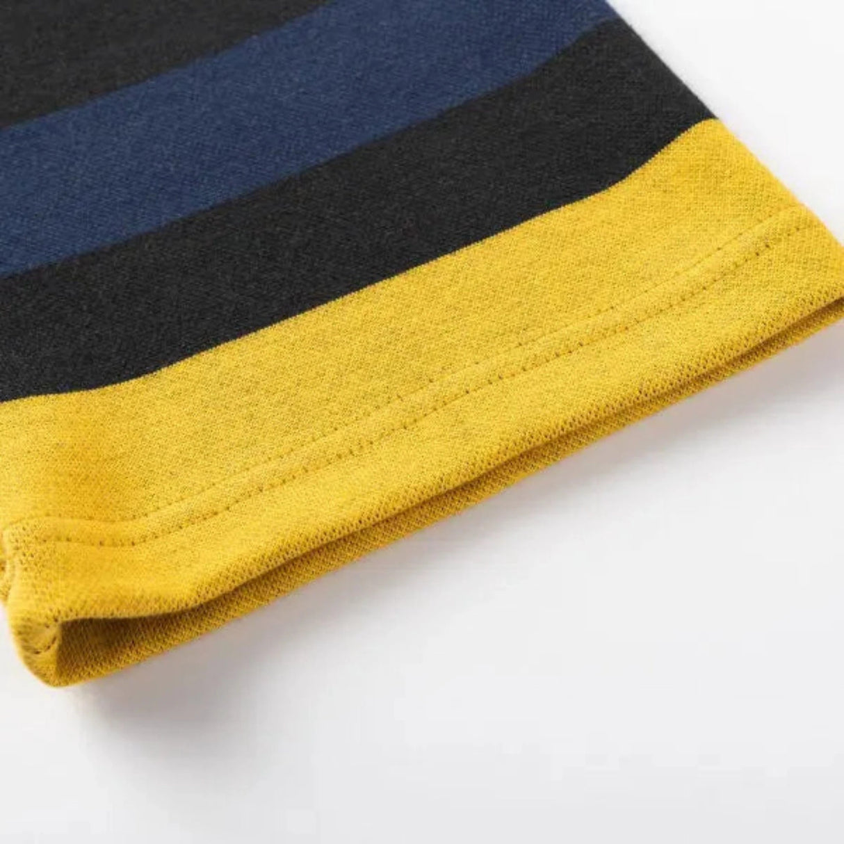 Detailed view of the Limited Edition Hurricanes Super Rugby 25/26 Retro Jersey by Classic Sportswear, showcasing horizontal yellow, black, and dark blue stripes reminiscent of classic athletic apparel.