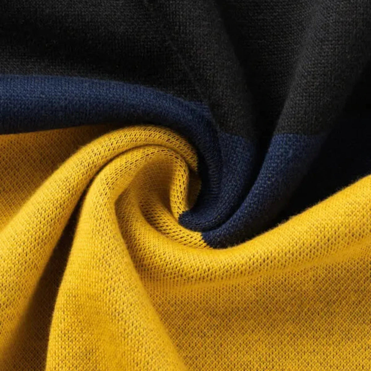 A close-up of the Limited Edition Hurricanes Super Rugby 25/26 Retro Jersey by Classic Sportswear reveals vibrant hues of yellow, black, and dark blue.