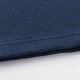 Close-up of the Limited Edition Highlanders Super Rugby 25/26 Retro Jersey by Classic Sportswear's hem in dark blue, highlighting its texture and stitching—a nod to classic sportswear.