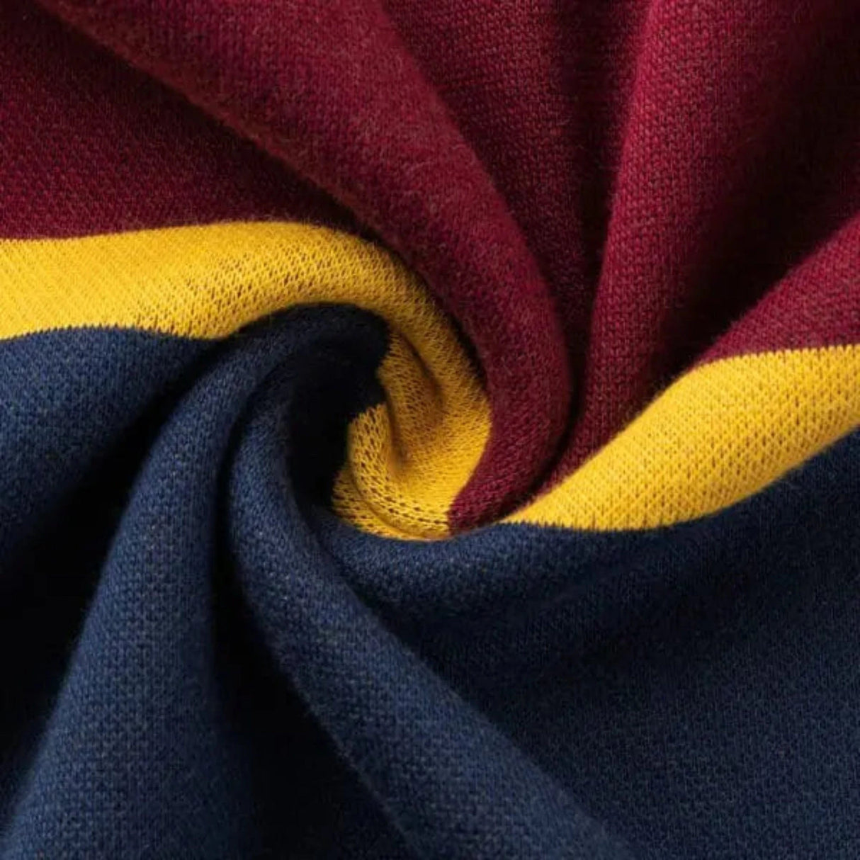 A close-up of the Limited Edition Highlanders Super Rugby 25/26 Retro Jersey by Classic Sportswear, featuring fabric with twisted folds and maroon, yellow, and navy blue stripes.