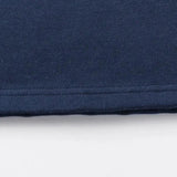Close-up of a navy blue fabric from the Limited Edition Blues Super Rugby 25/26 Retro Jersey by Classic Sportswear, showcasing its classic sportswear design with visible edge stitching.