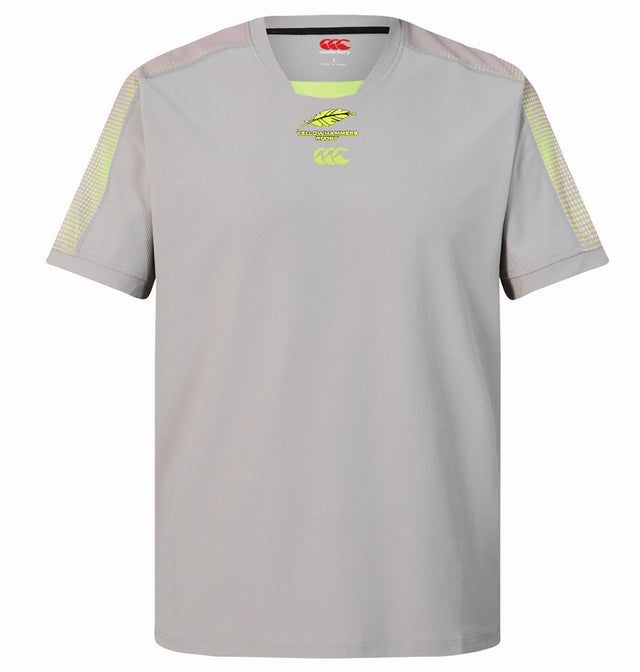 Introducing the Montgomery Yellowhammers Tempo + Drill Top by EMB Canterbury—a light grey, short-sleeved rugby training shirt featuring distinctive yellow accents on the shoulders and chest logos. Engineered with moisture-wicking performance fabric, this Canterbury drill top keeps you comfortable throughout every training session.