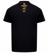 The Montgomery Yellowhammers Tempo + Drill Top by EMB Canterbury is a black short-sleeve rugby training shirt with gold stitching, featuring a yellow Springbok logo and the CCC logo on the chest. Designed for performance, it provides moisture-wicking comfort during intense sessions.