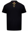 The Montgomery Yellowhammers Tempo + Drill Top by EMB Canterbury is a black short-sleeve rugby training shirt with gold stitching, featuring a yellow Springbok logo and the CCC logo on the chest. Designed for performance, it provides moisture-wicking comfort during intense sessions.