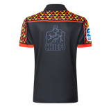 The Gallagher Chiefs Super Rugby 25/26 Team Polo by Classic Sportswear is a black sports jersey with moisture-wicking fabric, geometric shoulder patterns, "CHIEFS" text, and a bold gorilla illustration on the back—ideal for Chiefs fans seeking style and comfort.