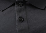 Close-up of the Gallagher Chiefs Super Rugby 25/26 Team Polo by Classic Sportswear, a black polo shirt with two buttons fastened, crafted from moisture-wicking fabric.