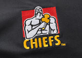 The Gallagher Chiefs Super Rugby 25/26 Team Polo by Classic Sportswear showcases a muscular figure with a hammer on a red background, while "CHIEFS" features in yellow on moisture-wicking fabric, capturing the dynamic spirit of Chiefs Super Rugby.