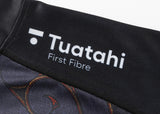 Close-up of a black fabric featuring the white "Tuatahi First Fibre" logo, similar to the iconic pattern of the Classic Sportswear Gallagher Chiefs Super Rugby Replica Home Jersey 25/26.