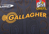 Close-up of a Gallagher Chiefs Super Rugby Replica Home Jersey 25/26 by Classic Sportswear with "Gallagher" and "Chiefs" logos. This stylish jersey embodies the team's spirit, making it ideal for any fan.