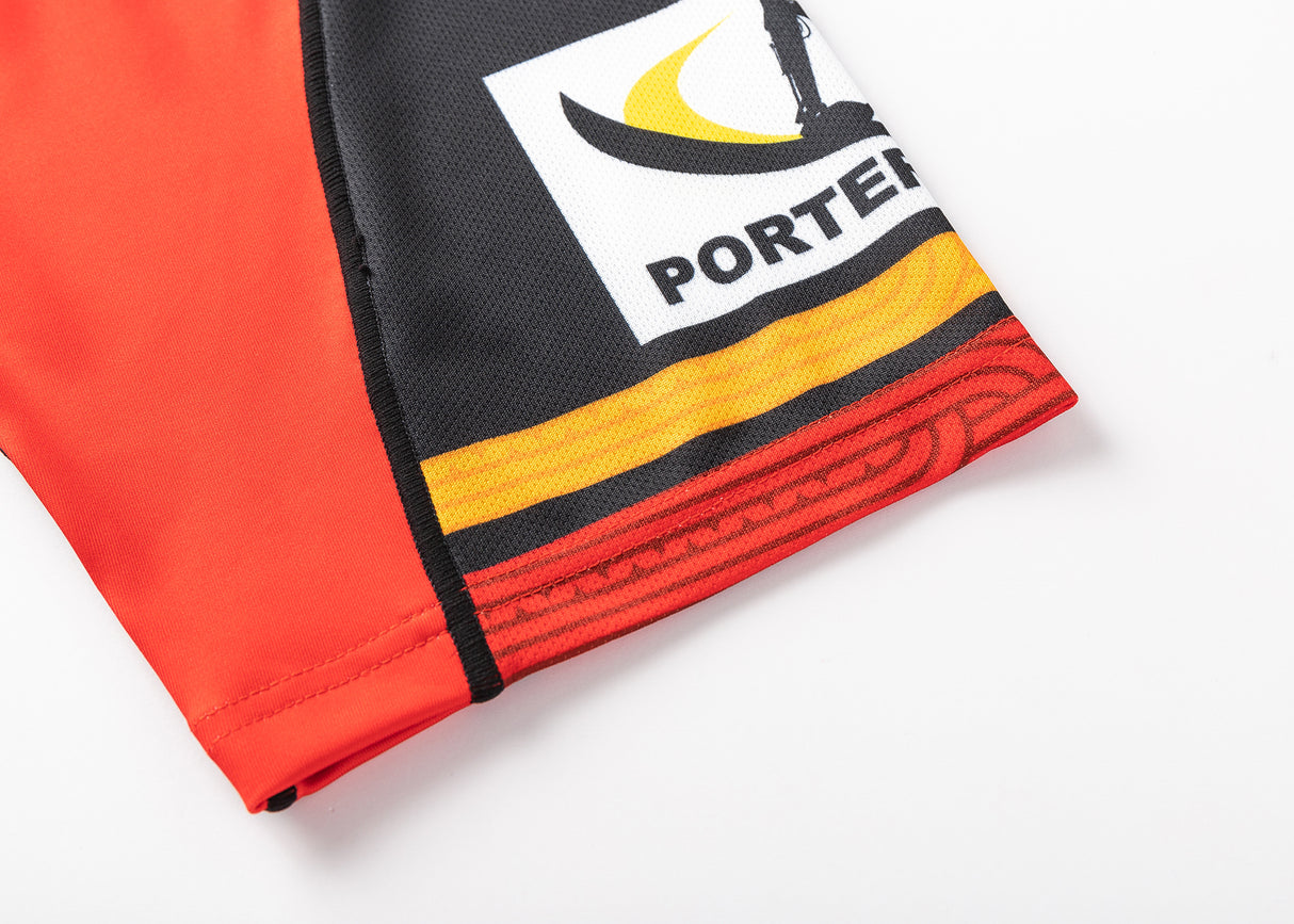 Close-up of a Gallagher Chiefs Super Rugby Replica Home Jersey 25/26 by Classic Sportswear, featuring Māori-inspired yellow and orange stripes, with a silhouette logo and "PORTER" in bold letters.