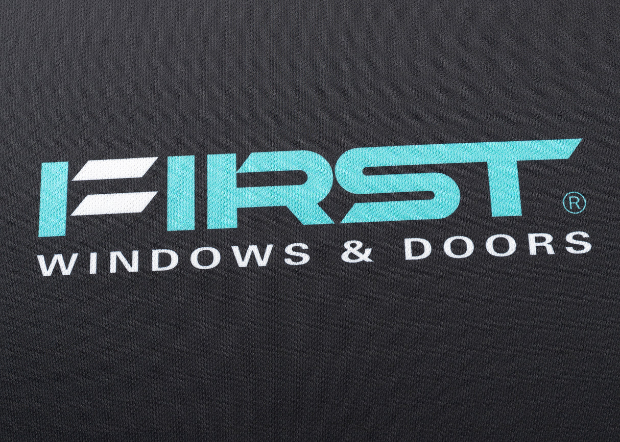 The teal and white FIRST WINDOWS & DOORS logo on a dark backdrop evokes the energy of sporting icons, similar to Classic Sportswear's Gallagher Chiefs Super Rugby Replica Home Jersey 25/26.