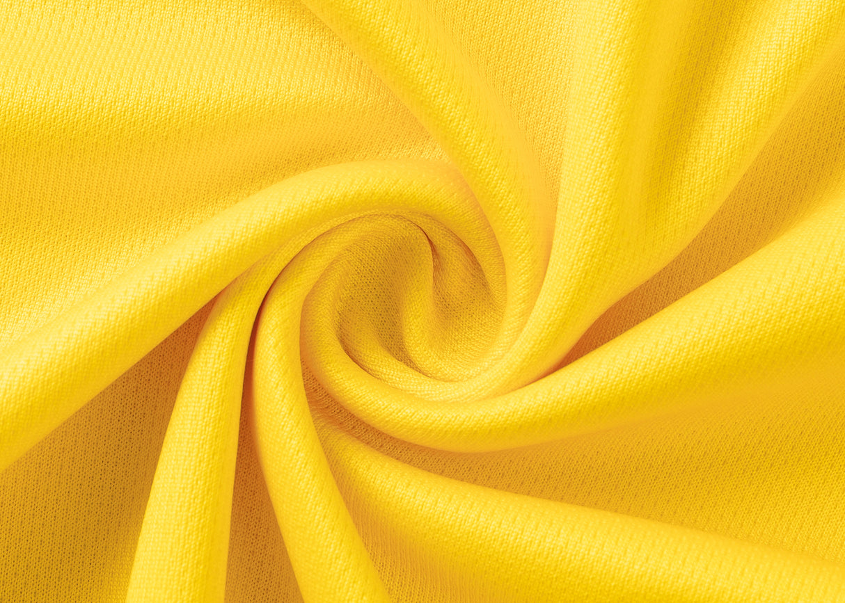 Close-up of yellow fabric spiraled, resembling the Hurricanes Super Rugby 25/26 Replica Home Jersey by Classic Sportswear, highlighting its texture and vibrant color.